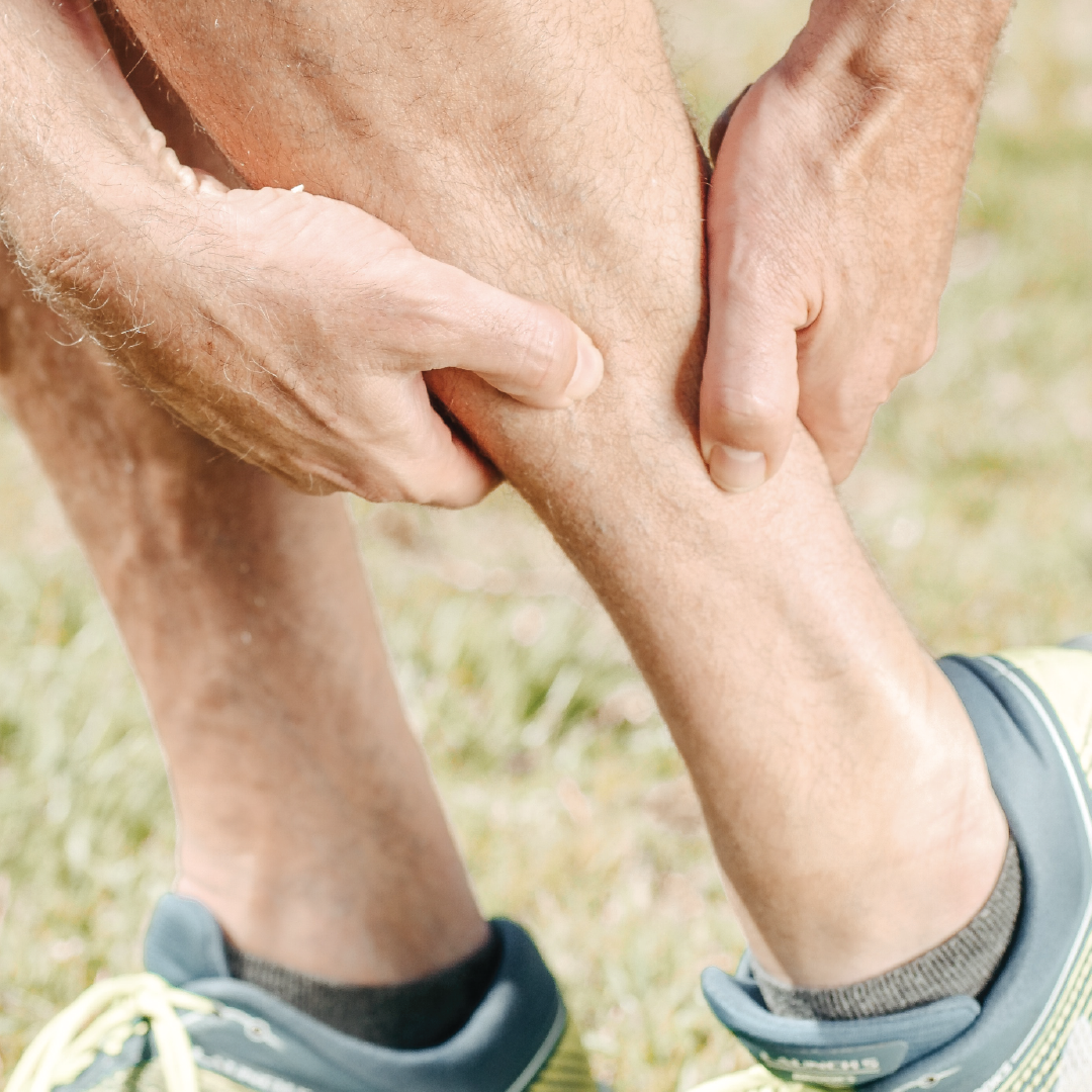 man holding his neck in pain